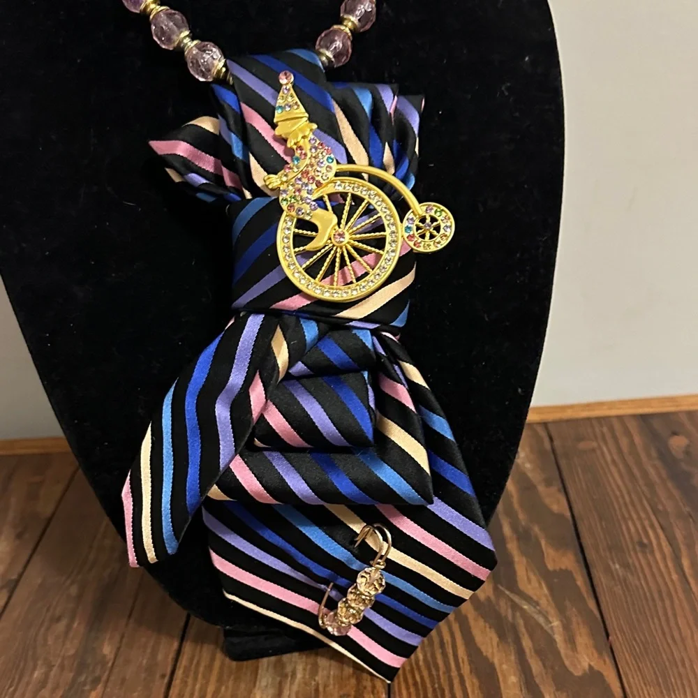Multicolored vintage silk tie Necklace with a clown on a penny farthing brooch